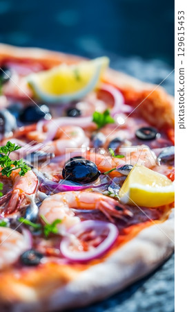 Delicious Seafood Pizza with Shrimp, Olives, and Lemon Slice. Delicious Seafood Pizza with Shrimp, Olives, and Lemon Slice. 129615453