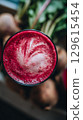Refreshing Beet Juice Smoothie with Frothy Top and Fresh Beets. 129615454