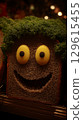 Friendly Food Face Made of Bread and Greens with Bright Eyes. 129615455