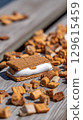 Sweet and Gooey Smores on a Wooden Table with Crumbles. 129615459