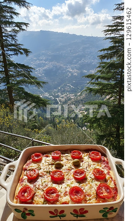Delicious Homemade Pizza with a Scenic Mountain View Backdrop. Delicious Homemade Pizza with a Scenic Mountain View Backdrop. 129615462