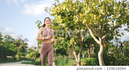 Asian exercise woman running at public park breathing fresh air wellness workout healthy lifestyle Asian exercise woman running at public park breathing fresh air wellness workout healthy lifestyle 129616004