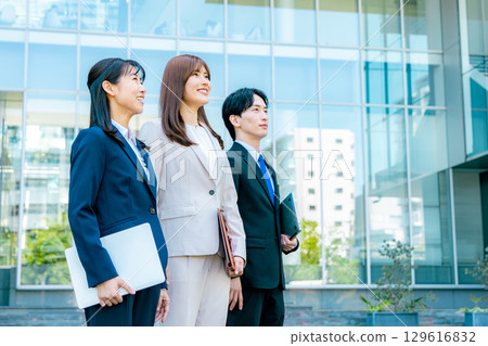 A business woman standing in an office town 129616832