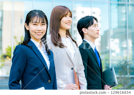 A business woman standing in an office town 129616834