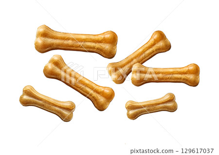 Dog treats that resemble festive bones for pets, isolated on white, PNG Dog treats that resemble festive bones for pets, isolated on white, PNG 129617037