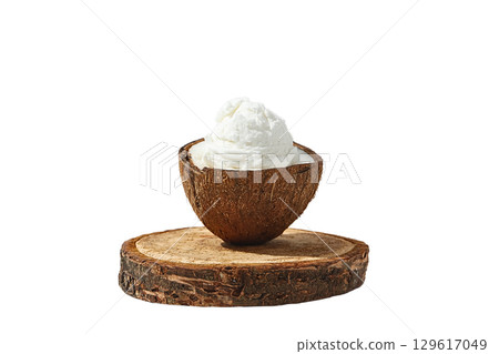 Whipped cream in a coconut shell on wood, isolated on white, PNG Whipped cream in a coconut shell on wood, isolated on white, PNG 129617049