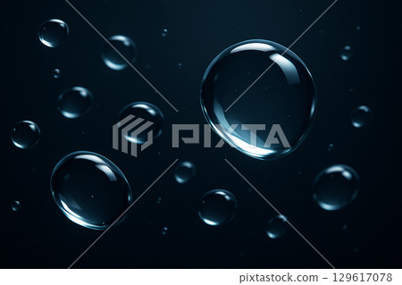 Realistic translucent water droplets with blue highlights floating in a dark space 129617078