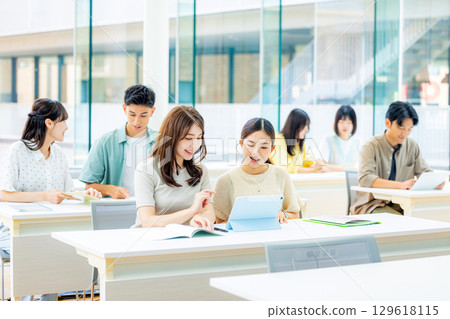 University students taking classes 129618115