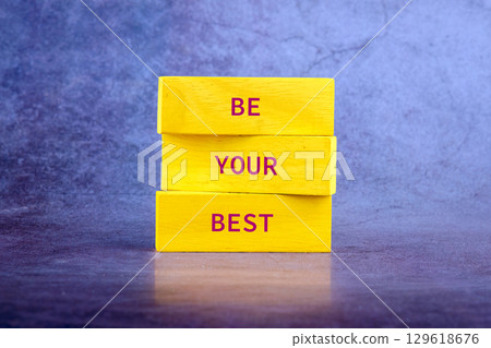 Copy space. Business concept. BE YOUR BEST on wooden blocks on a bright background 129618676