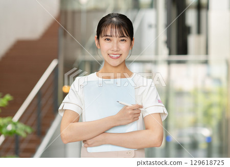 Young woman working in clinic 129618725