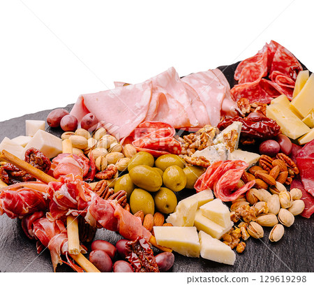 Delightful assorted charcuterie platter with cheeses and nuts for sharing Delightful assorted charcuterie platter with cheeses and nuts for sharing 129619298
