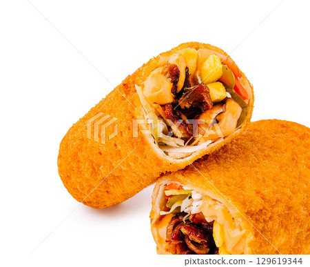 Crispy filled rolls with vibrant vegetables and savory filling on display 129619344