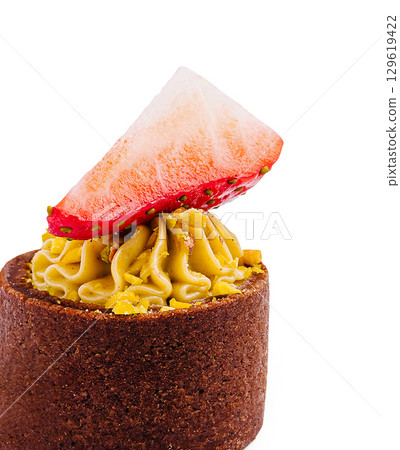 Delicious dessert with strawberry and creamy topping in a chocolate shell Delicious dessert with strawberry and creamy topping in a chocolate shell 129619422