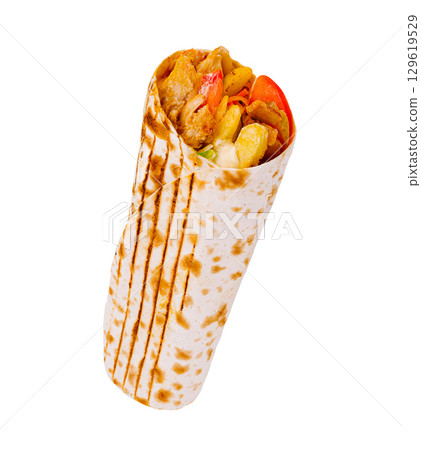 Delicious wrap filled with grilled meat and fresh vegetables ready to eat Delicious wrap filled with grilled meat and fresh vegetables ready to eat 129619529