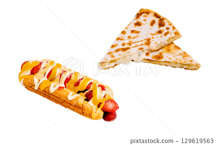 Unique food combinations with a loaded hot dog and cheesy quesadilla 129619563