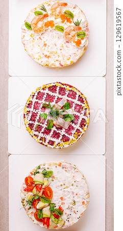Three beautifully crafted colorful layered salads are arranged in a box Three beautifully crafted colorful layered salads are arranged in a box 129619567