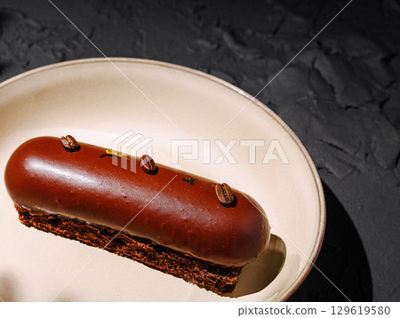 Delicious chocolate dessert served on a plate with decorative elements Delicious chocolate dessert served on a plate with decorative elements 129619580