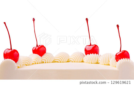 Celebration cake decorated with cherries and whipped cream on a white background 129619621