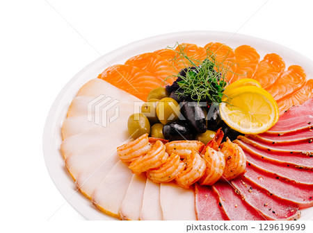 Delicious seafood platter featuring shrimp, olives, and various fish slices Delicious seafood platter featuring shrimp, olives, and various fish slices 129619699