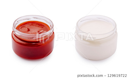 Condiments served in small jars for culinary enjoyment at gatherings 129619722