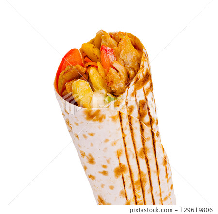 Delicious chicken wrap filled with fresh vegetables and spices for lunch 129619806