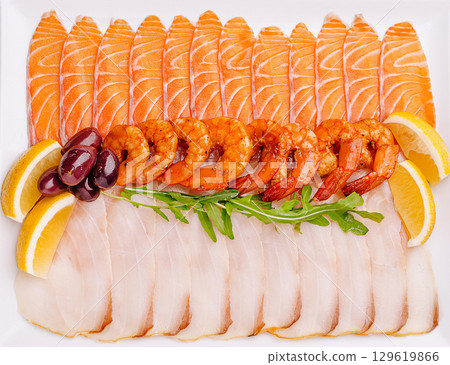 A colorful assortment of fresh seafood arranged beautifully 129619866