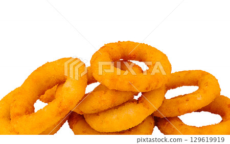 Delicious golden onion rings stacked on a white background Delicious golden onion rings stacked on a white background 129619919