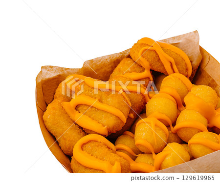 Tasty fried snacks with melted cheese sauce ready for enjoyment at a party 129619965