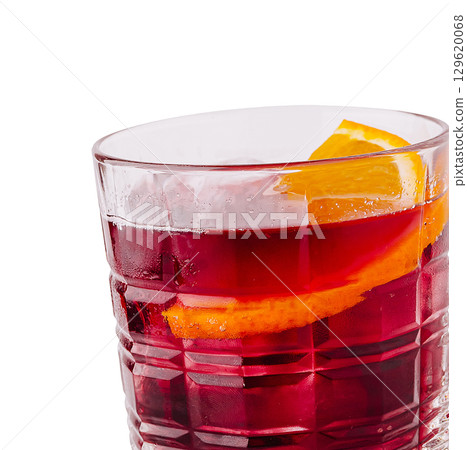 Refreshing drink with orange slice served in a glass at a casual gathering Refreshing drink with orange slice served in a glass at a casual gathering 129620068