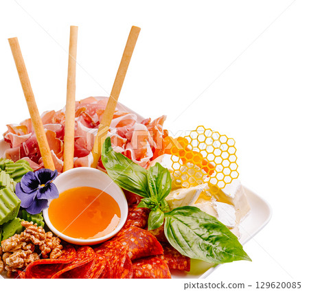 Beautiful gourmet platter of assorted meats, cheeses, and honeycomb 129620085