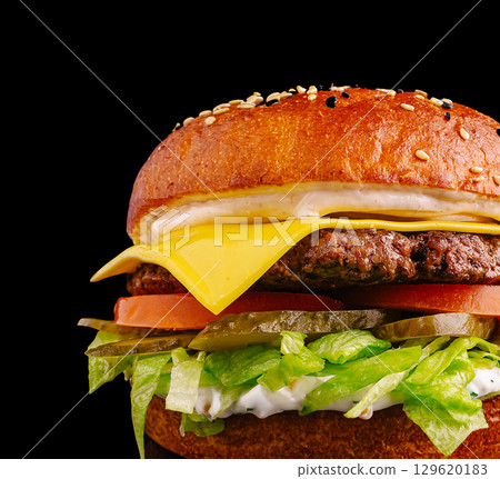 Delicious hamburger with fresh ingredients and melted cheese Delicious hamburger with fresh ingredients and melted cheese 129620183