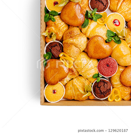 Delicious assortment of pastries and desserts in a dessert box Delicious assortment of pastries and desserts in a dessert box 129620187