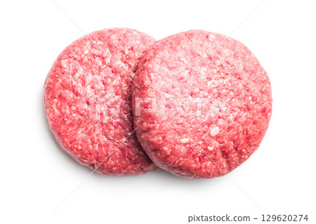 Raw burger beef patties isolated on white background. 129620274