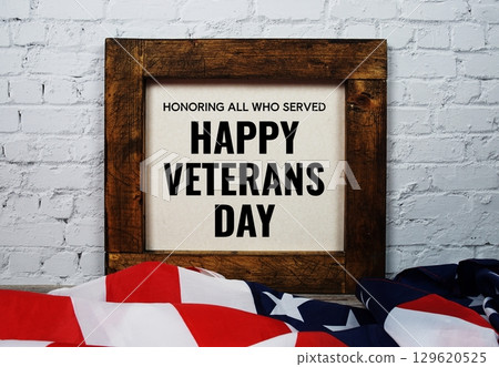 Happy Veterans Day alphabet letter and American flag on wooden background 129620525