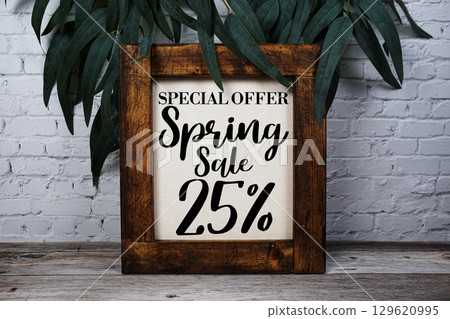 Spring Sale 25% Promotion and Marketing on wooden background 129620995