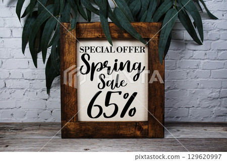 Spring Sale 65% Promotion and Marketing on wooden background 129620997