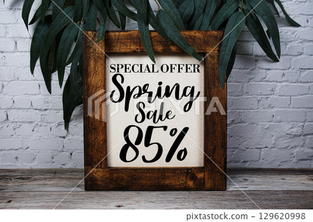 Spring Sale 85% Promotion and Marketing on wooden background 129620998