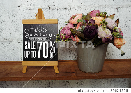 Spring Sale 70% Promotion and Marketing with easel with flowers bouquet decoration Spring Sale 70% Promotion and Marketing with easel with flowers bouquet decoration 129621226