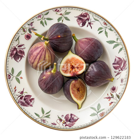 Fresh ripe figs arranged on decorative ceramic plates, mediterranean fruit display isolated on transparent background 129622183