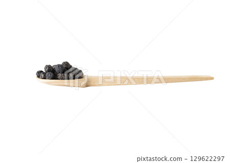 Dried Prunus spinosa, called blackthorn or sloe on wooden spoon isolated on white background. 129622297