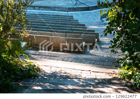 Outdoor amphitheater with stone steps and seating area Outdoor amphitheater with stone steps and seating area 129622477