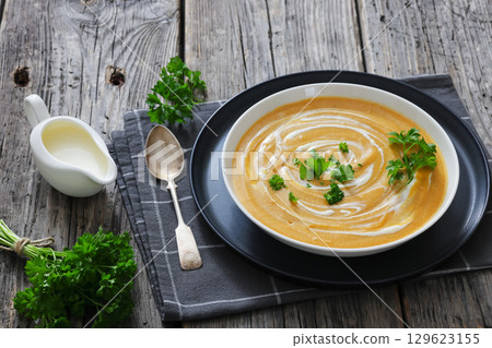 roasted parsnip and carrot soup, top view 129623155
