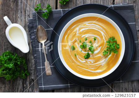 roasted parsnip and carrot soup, top view roasted parsnip and carrot soup, top view 129623157