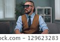 A man is watching holographic screens. 129623283