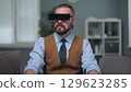 A man is watching holographic screens. 129623285
