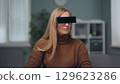 A woman is watching holographic screens. 129623286