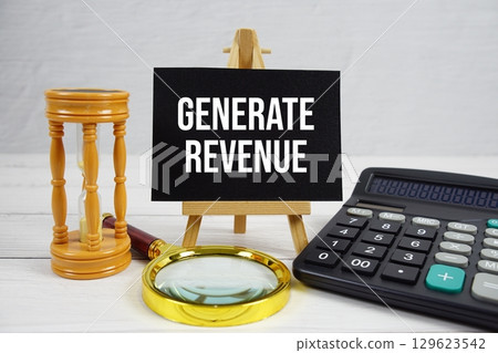 Generate Revenue text with magnifying glass and calculator on wooden background 129623542