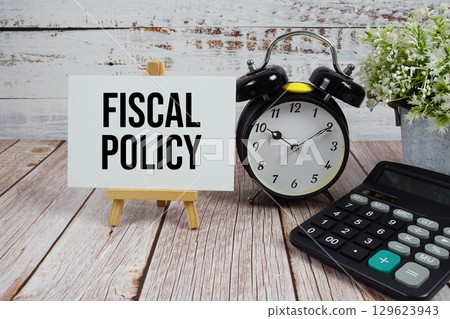 Fiscal Policy text with alarm clock and calculator on wooden background 129623943