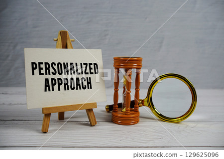 Personalized Approach text with hourglass and magnifying glass on wooden background 129625096