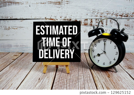 Estimated Time Of Delivery text with easel and alarm clock on wooden background 129625152
